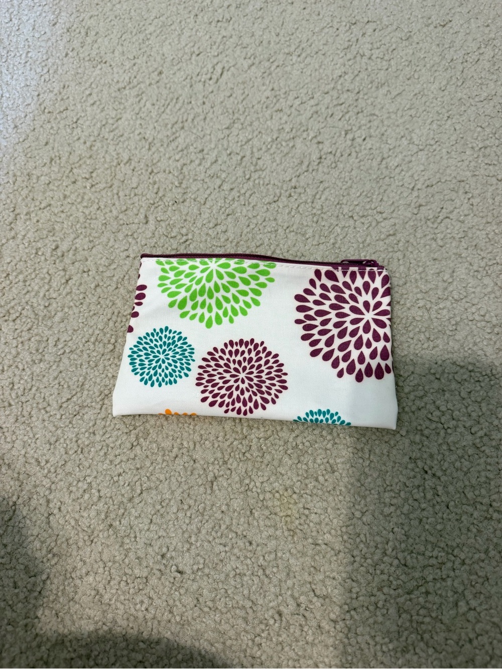 Floral zip-up cosmetic and travel pouch starburst or dahlia-style make up bag